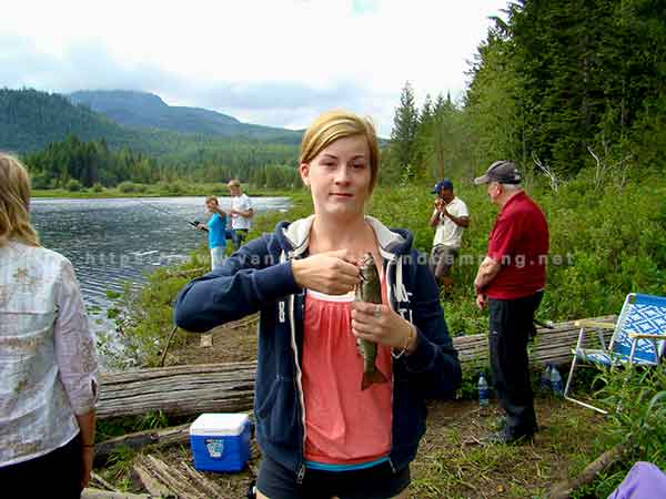 photo of my niece anna and her first trout on a family camping trip