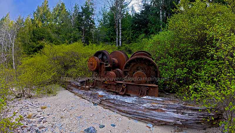 photo of a logging winch on the beach at Bonanza Lake on Vancouver Island British Columbia, Canada