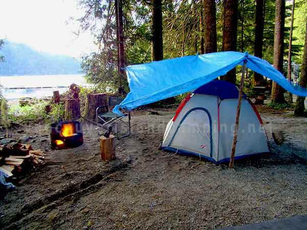 photo of a dome tent and tarp set up for camping in the rain at Cougar Creek Recreation Site