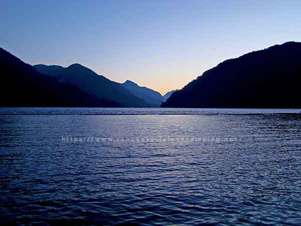 A beautiful photo of Muchalat Lake looking from the dock in the campround.