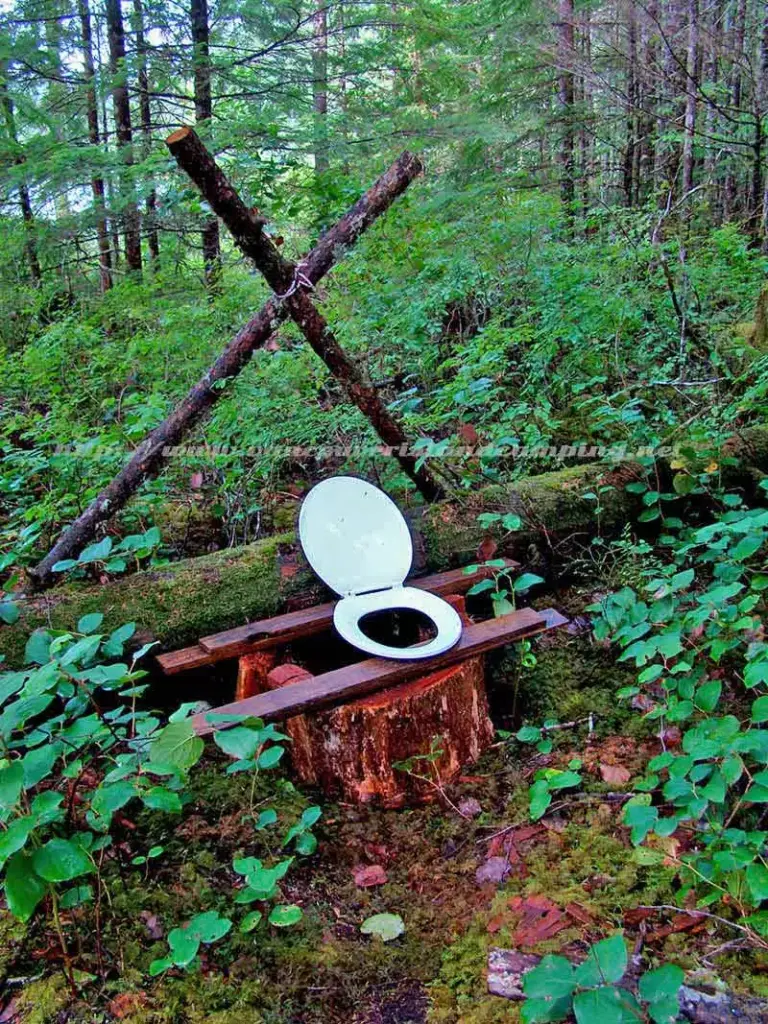 photo of a make shift toilet over a limestone cave on Paterson Lake Campground
