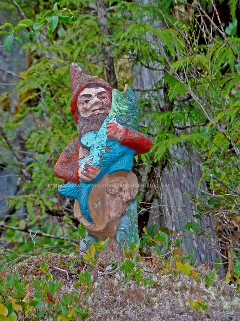 photo of a Gnome on a rock bluff along the shoreline of Atluck Lake on Vancouver Island