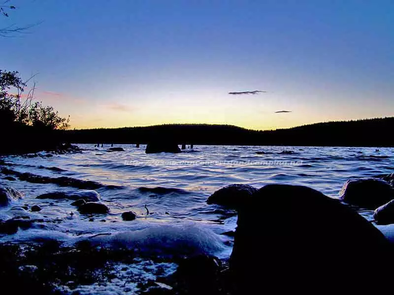 beautiful photo of waves crashing the beach on Merrill Lake at sunset