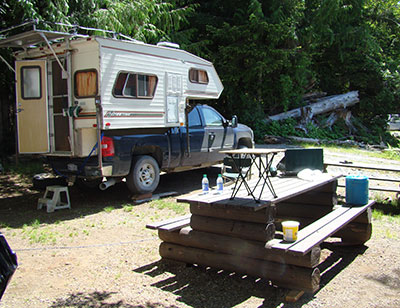 photo of my pickup camper at Muchalat Lake Recreation site after it has been prepared for the upcoming season.