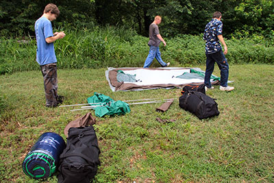 photo of campers setting up their tent