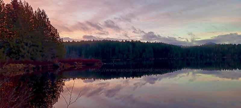 photo of a sunrise over Fry Lake Peninsula Campground on Vancouver Island BC Canada
