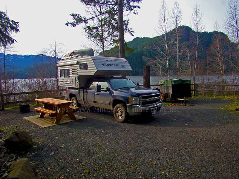 photo of a pickup camper at Upper Campbell Reservoir Campground on Vancouver Island Canada