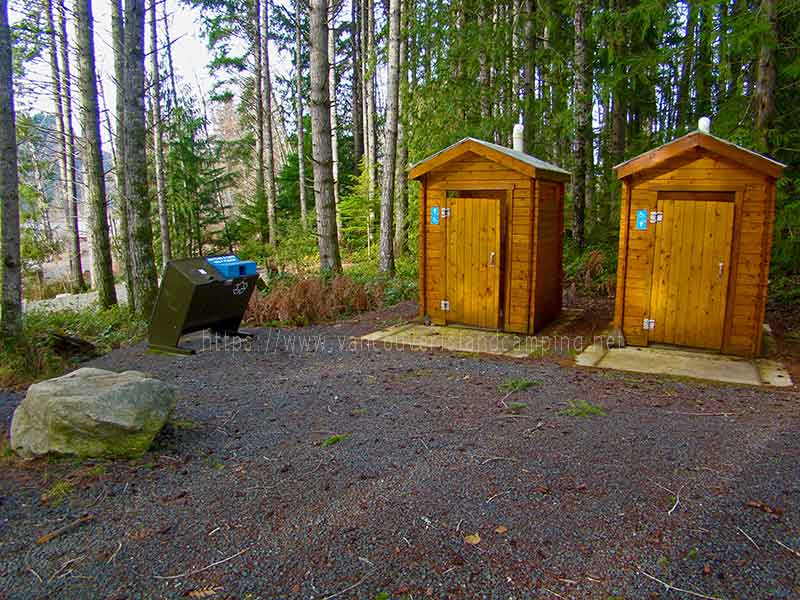photo of the pit toilets at Upper Campbell Reservoir Campground on Vancouver Island in British Columbia, Canada