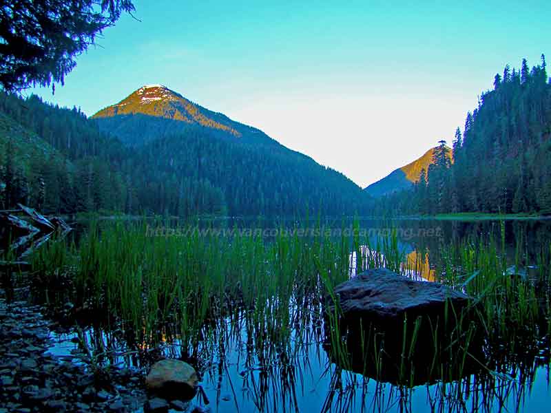 photo of Stewart Lake in early morning light at the Stewart Lake Recreation Site on Vancouver Island British Columbia, Canada